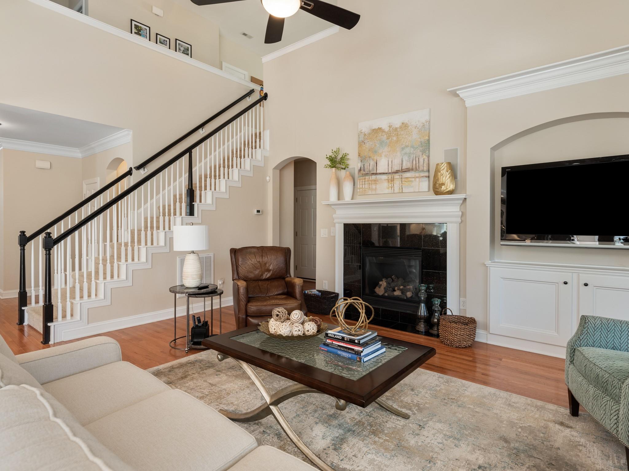 4300 Birkshire Heights Fort Mill, SC 29708 - Photo 15 of 40 a living room with furniture a flat screen tv and a fireplace