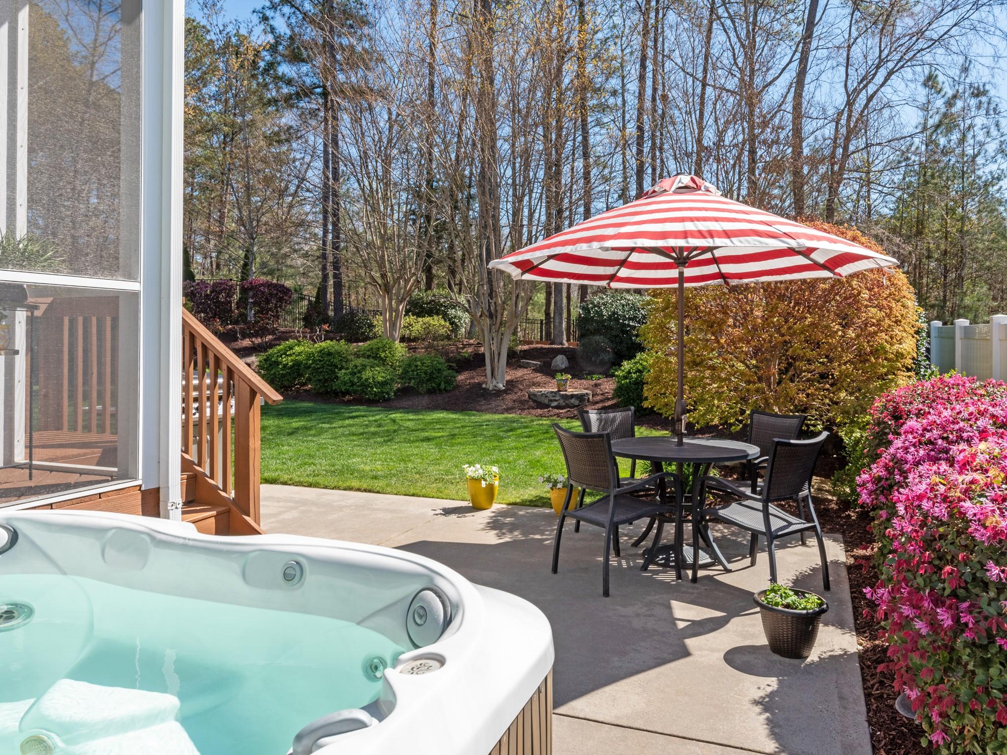 4300 Birkshire Heights Fort Mill, SC 29708 - Photo 30 of 40 a view of a tables and chairs under an umbrella