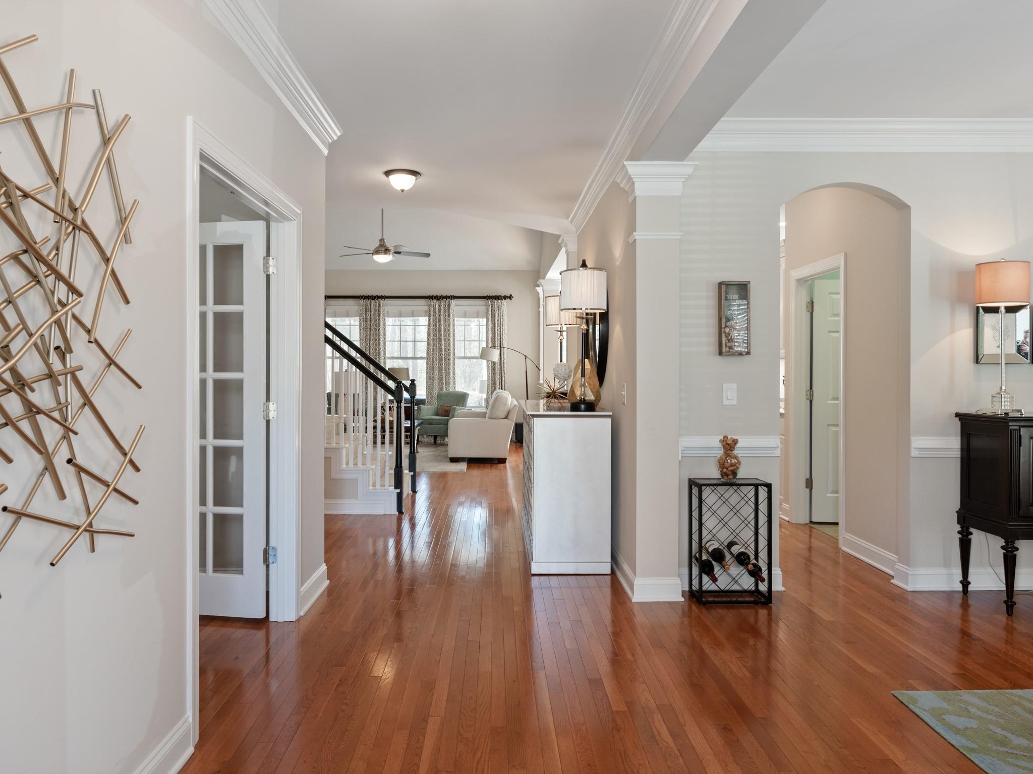 4300 Birkshire Heights Fort Mill, SC 29708 - Photo 3 of 40 a view of a living room with wooden floor and a kitchen