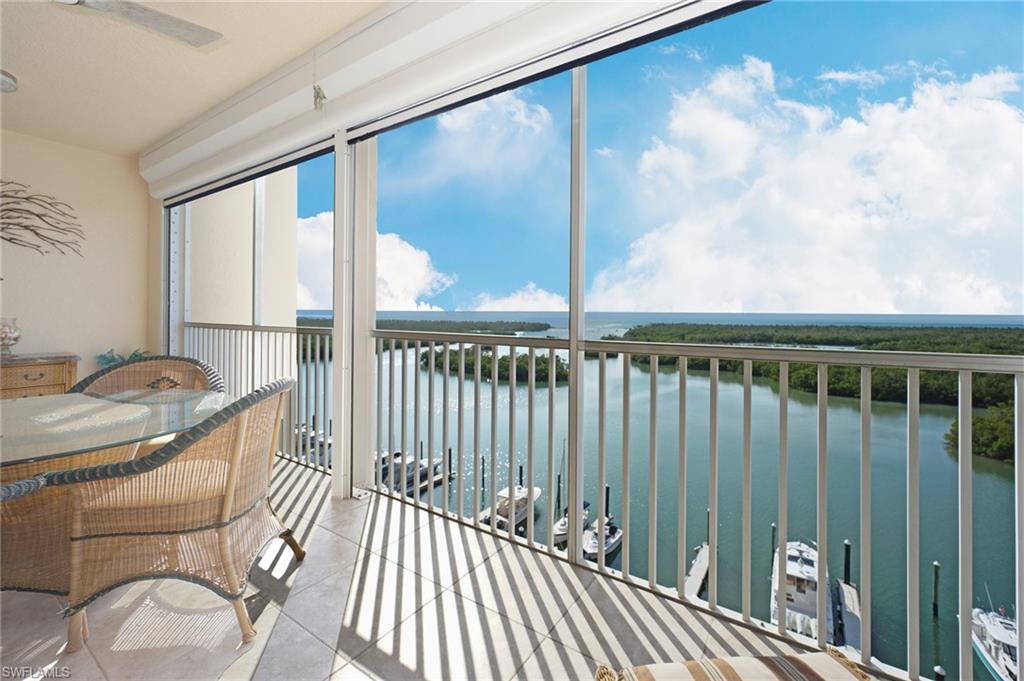 435 Dockside Drive, Unit B803 Naples, FL 34110 - Photo 11 of 35 Sunroom / solarium featuring a water view