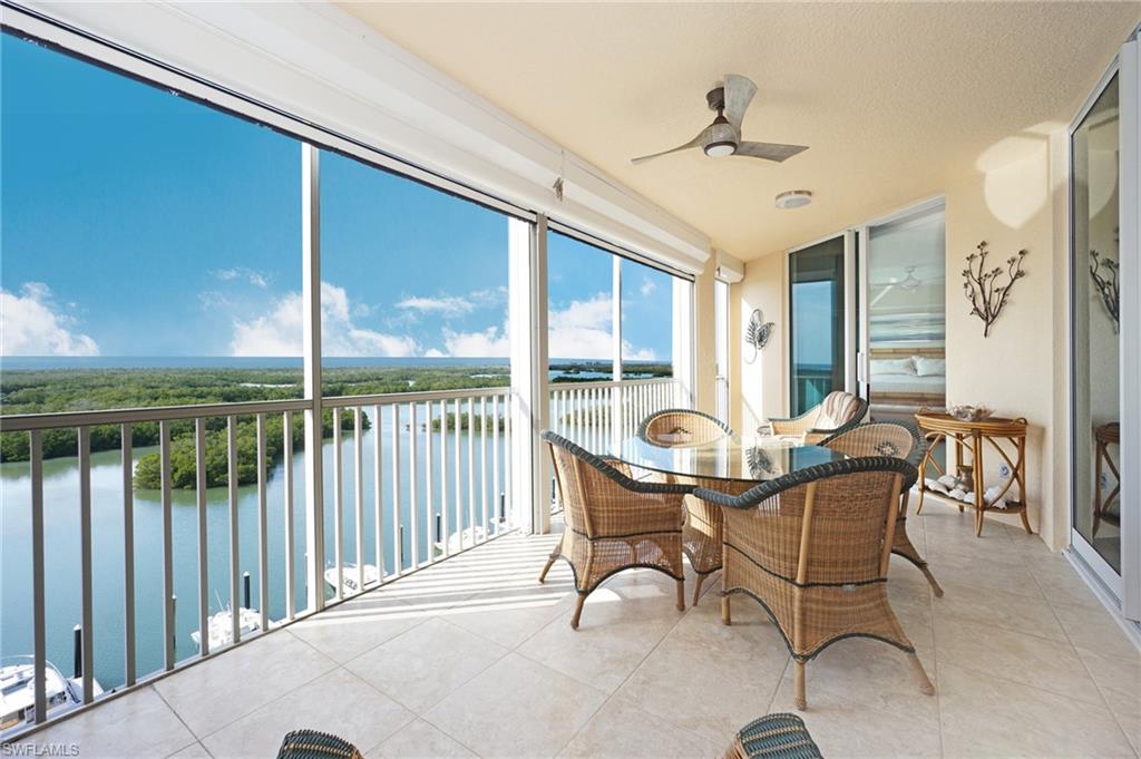 435 Dockside Drive, Unit B803 Naples, FL 34110 - Photo 12 of 35 Sunroom / solarium featuring a water view and ceiling fan