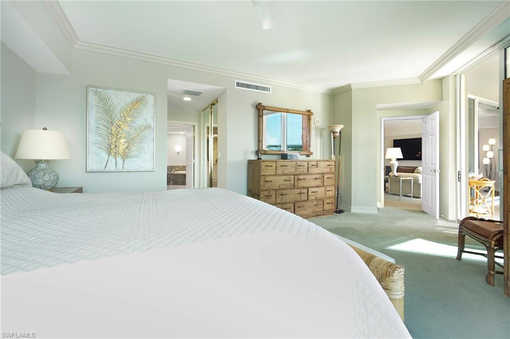 435 Dockside Drive, Unit B803 Naples, FL 34110 - Photo 24 of 35 Bedroom featuring ornamental molding, carpet floors, and ensuite bath