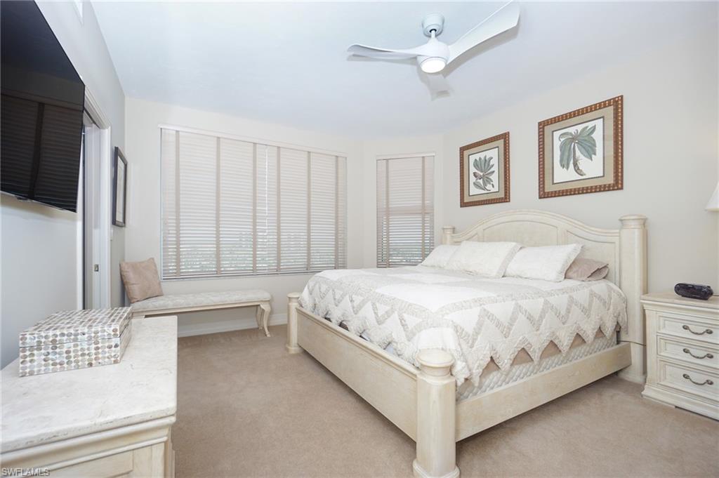 435 Dockside Drive, Unit B803 Naples, FL 34110 - Photo 26 of 35 Bedroom featuring light colored carpet and ceiling fan