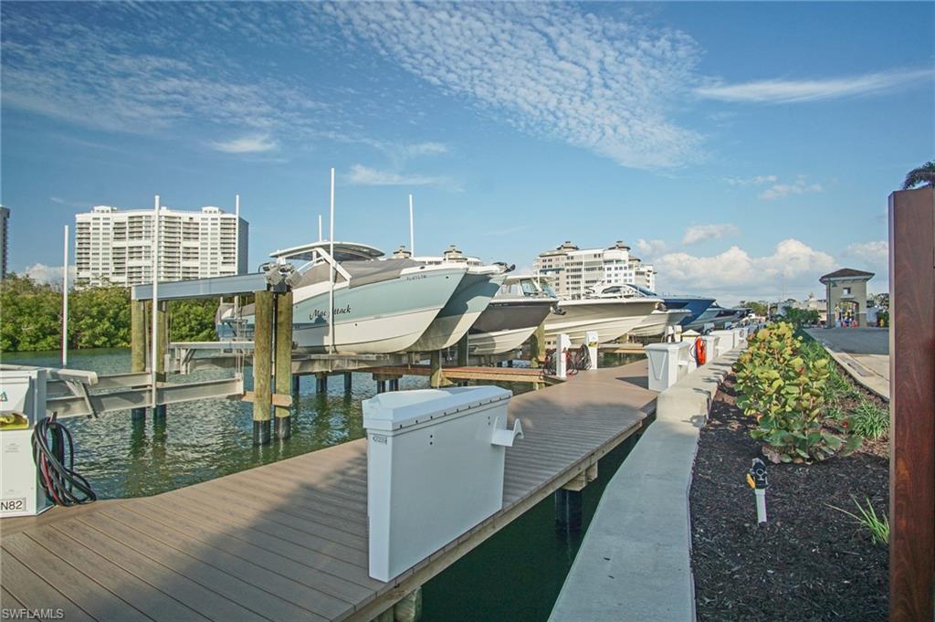 435 Dockside Drive, Unit B803 Naples, FL 34110 - Photo 31 of 35 View of dock featuring a water view