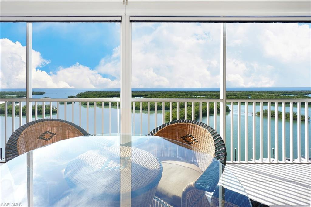 435 Dockside Drive, Unit B803 Naples, FL 34110 - Photo 10 of 35 Sunroom / solarium with a water view and a wealth of natural light