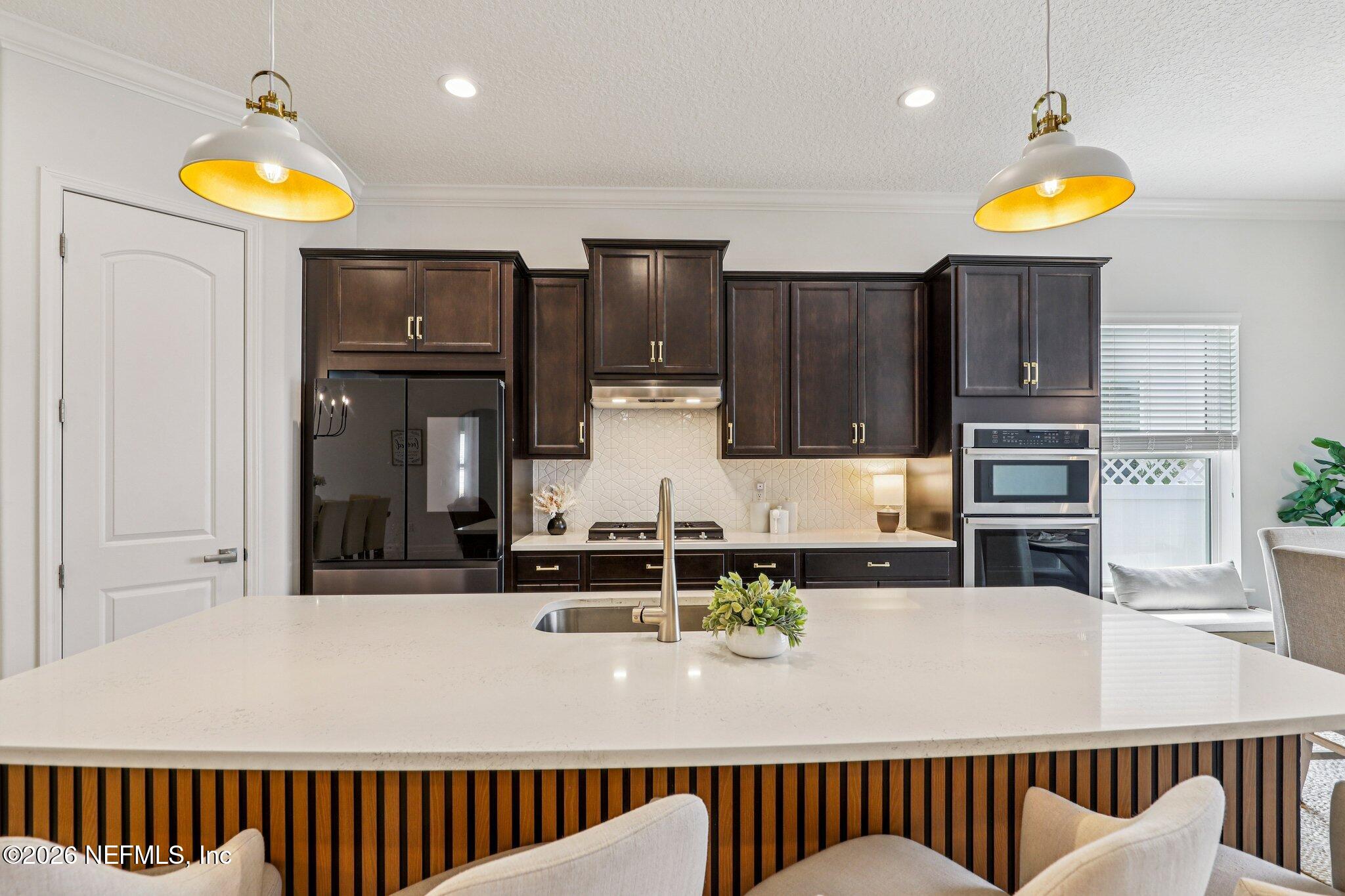 84 Firecrest Drive St. Augustine, FL 32092 - Photo 2 of 72 a kitchen with stainless steel appliances granite countertop a sink and a refrigerator