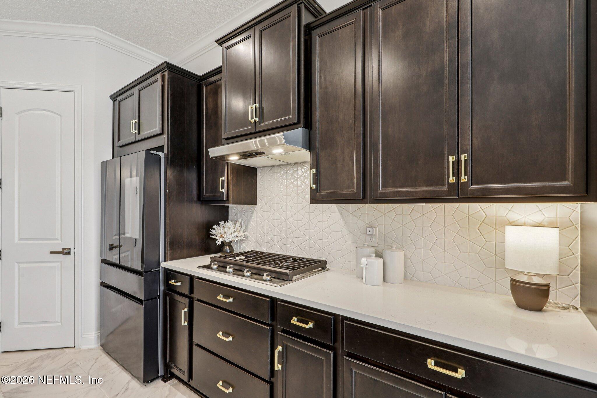 84 Firecrest Drive St. Augustine, FL 32092 - Photo 24 of 72 a kitchen with a refrigerator and a sink