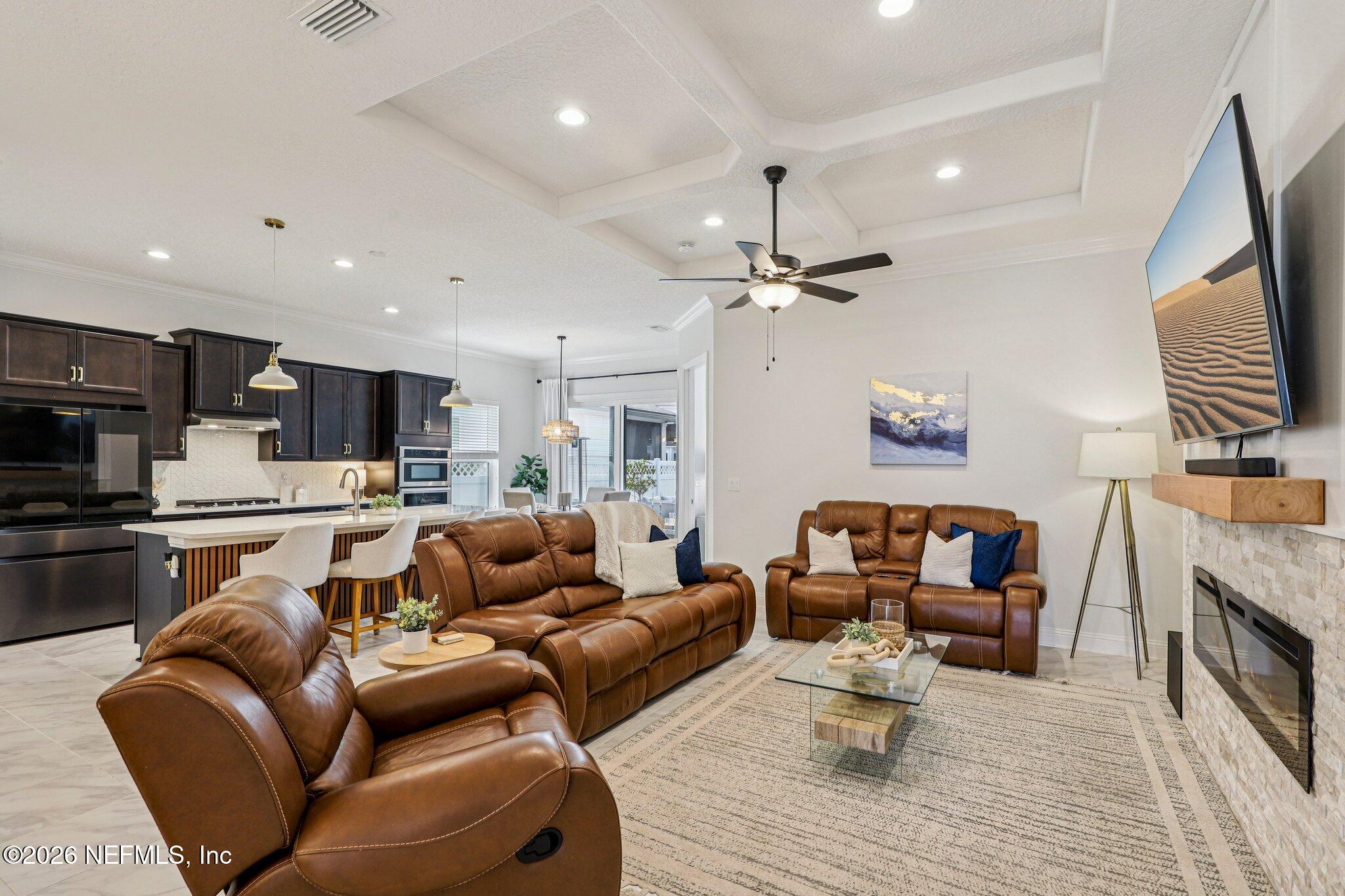 84 Firecrest Drive St. Augustine, FL 32092 - Photo 3 of 72 a living room with furniture and a fireplace