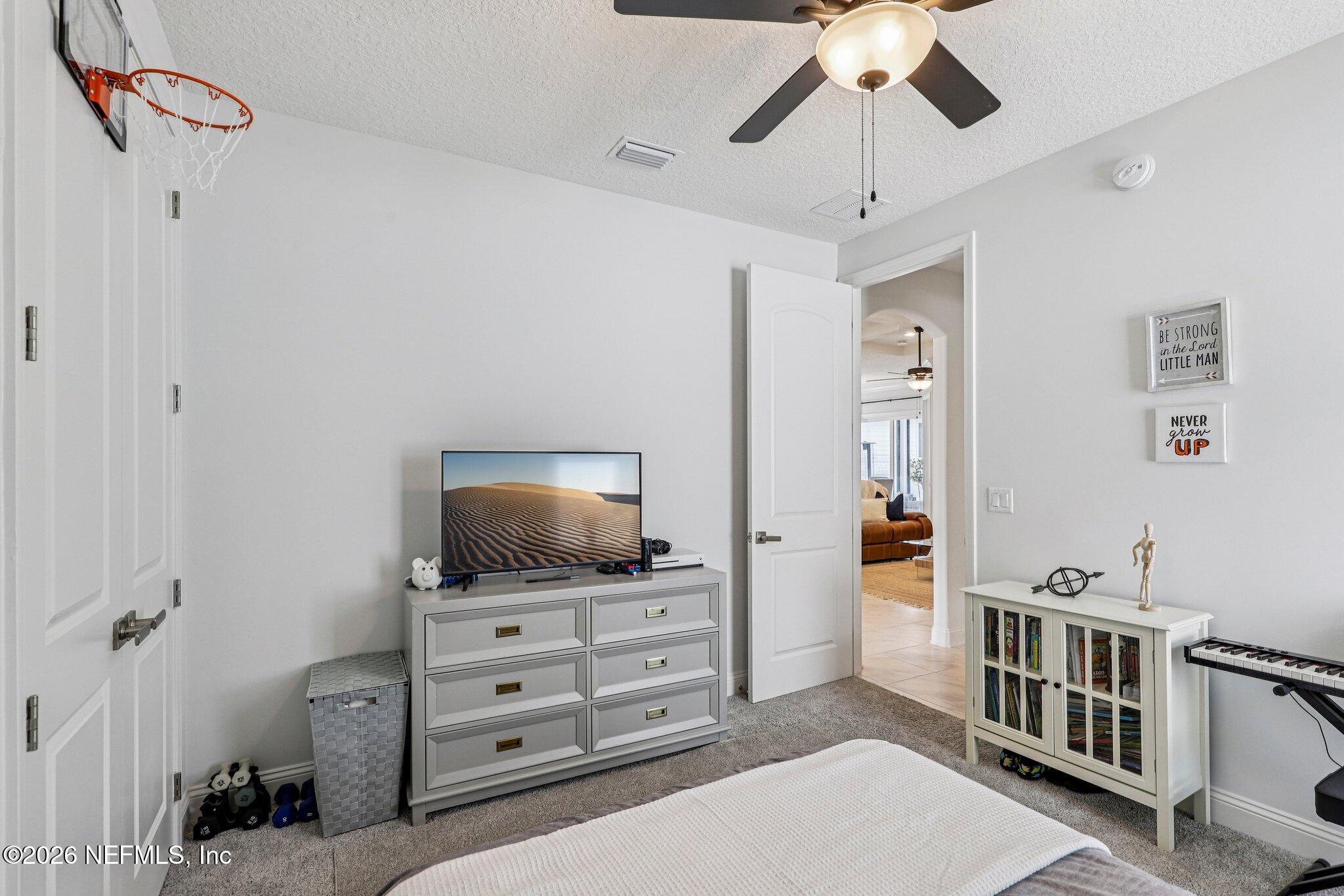 84 Firecrest Drive St. Augustine, FL 32092 - Photo 33 of 72 a living room with furniture and a flat screen tv