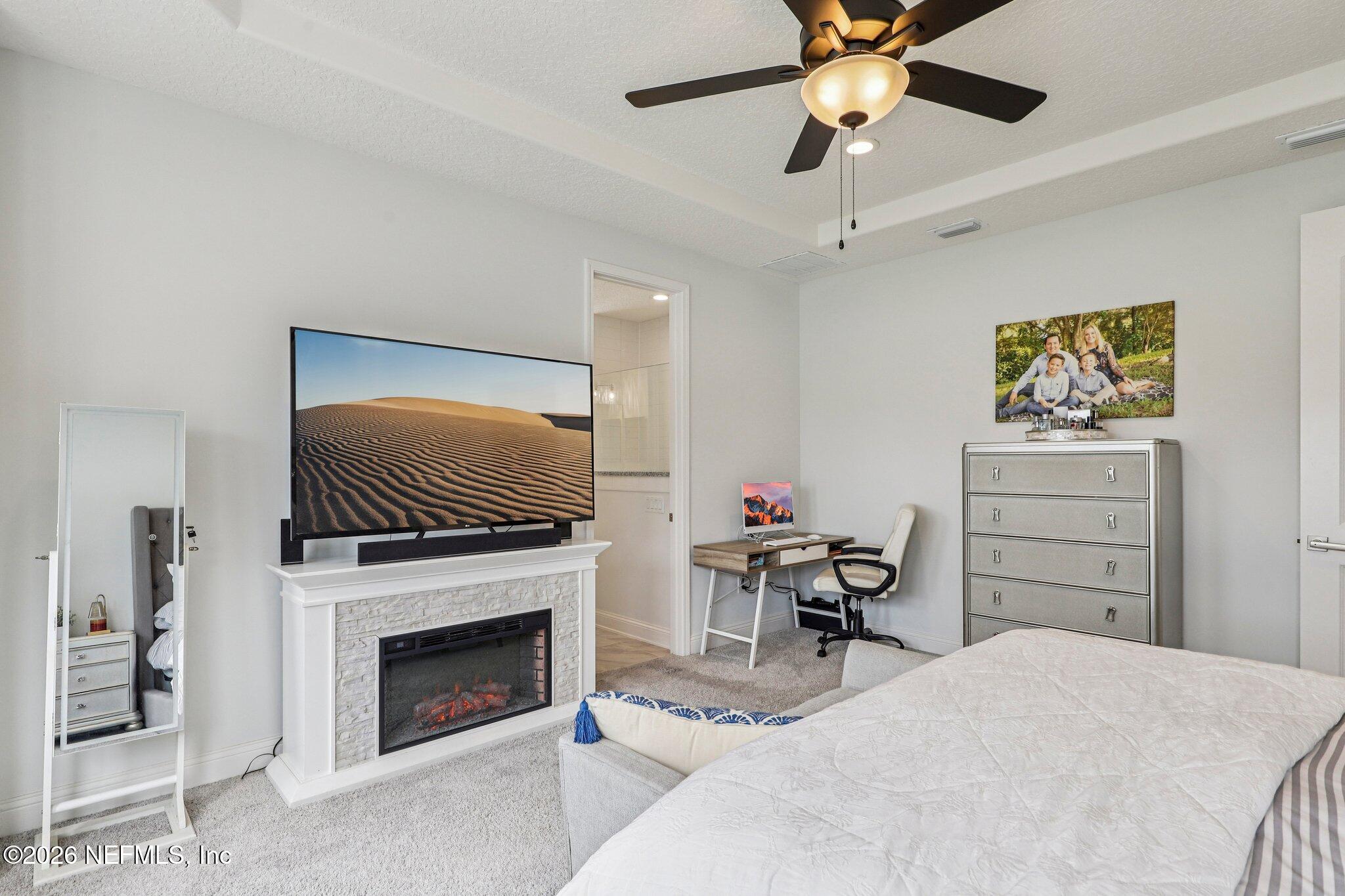 84 Firecrest Drive St. Augustine, FL 32092 - Photo 38 of 72 a bedroom with a bed and a flat screen tv
