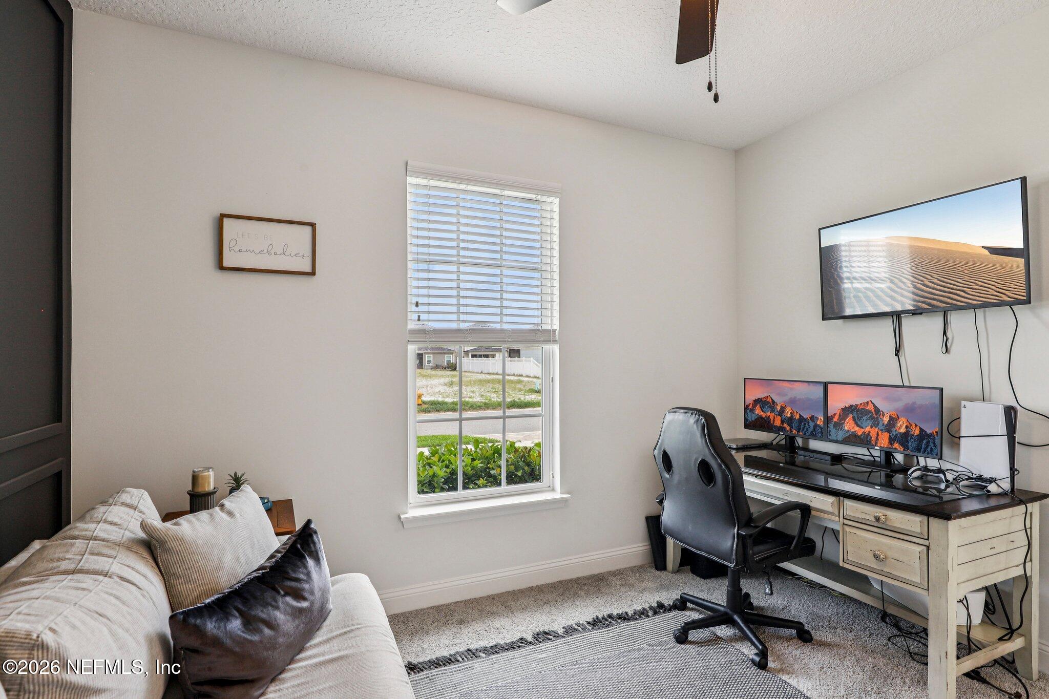84 Firecrest Drive St. Augustine, FL 32092 - Photo 42 of 72 a living room with furniture and a window