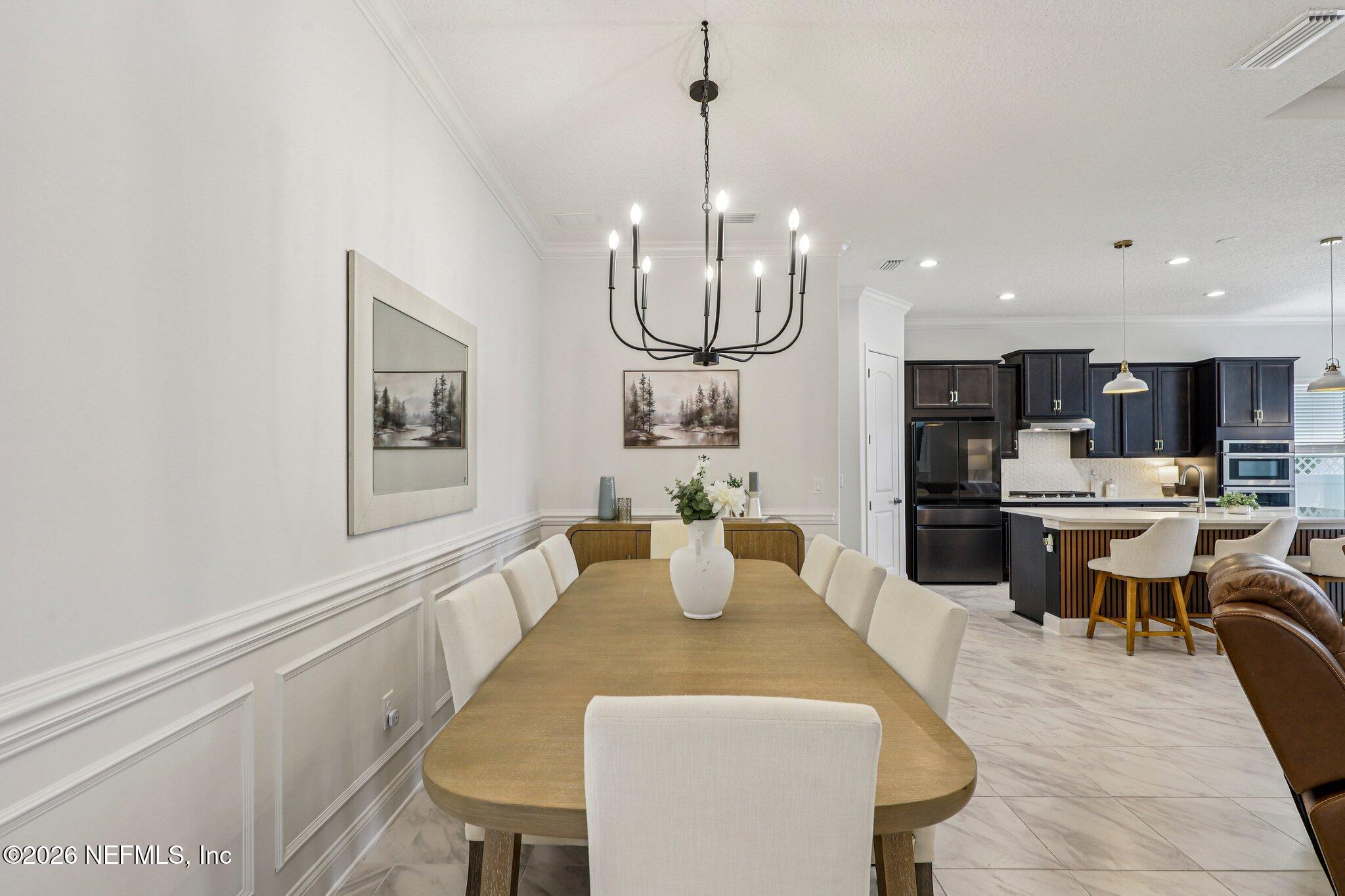 84 Firecrest Drive St. Augustine, FL 32092 - Photo 5 of 72 a view of a dining room with furniture