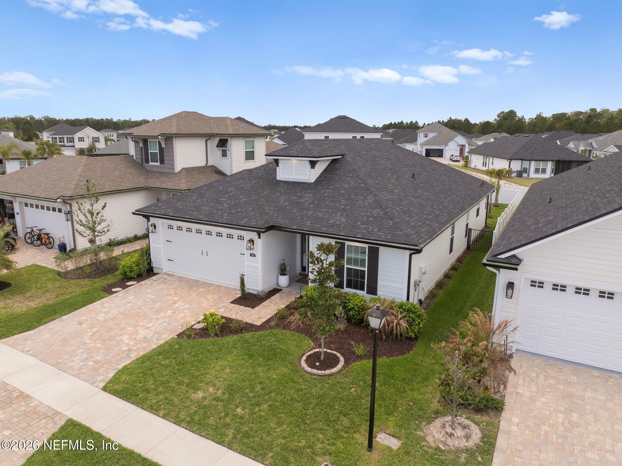 84 Firecrest Drive St. Augustine, FL 32092 - Photo 53 of 72 an aerial view of multiple houses with a yard