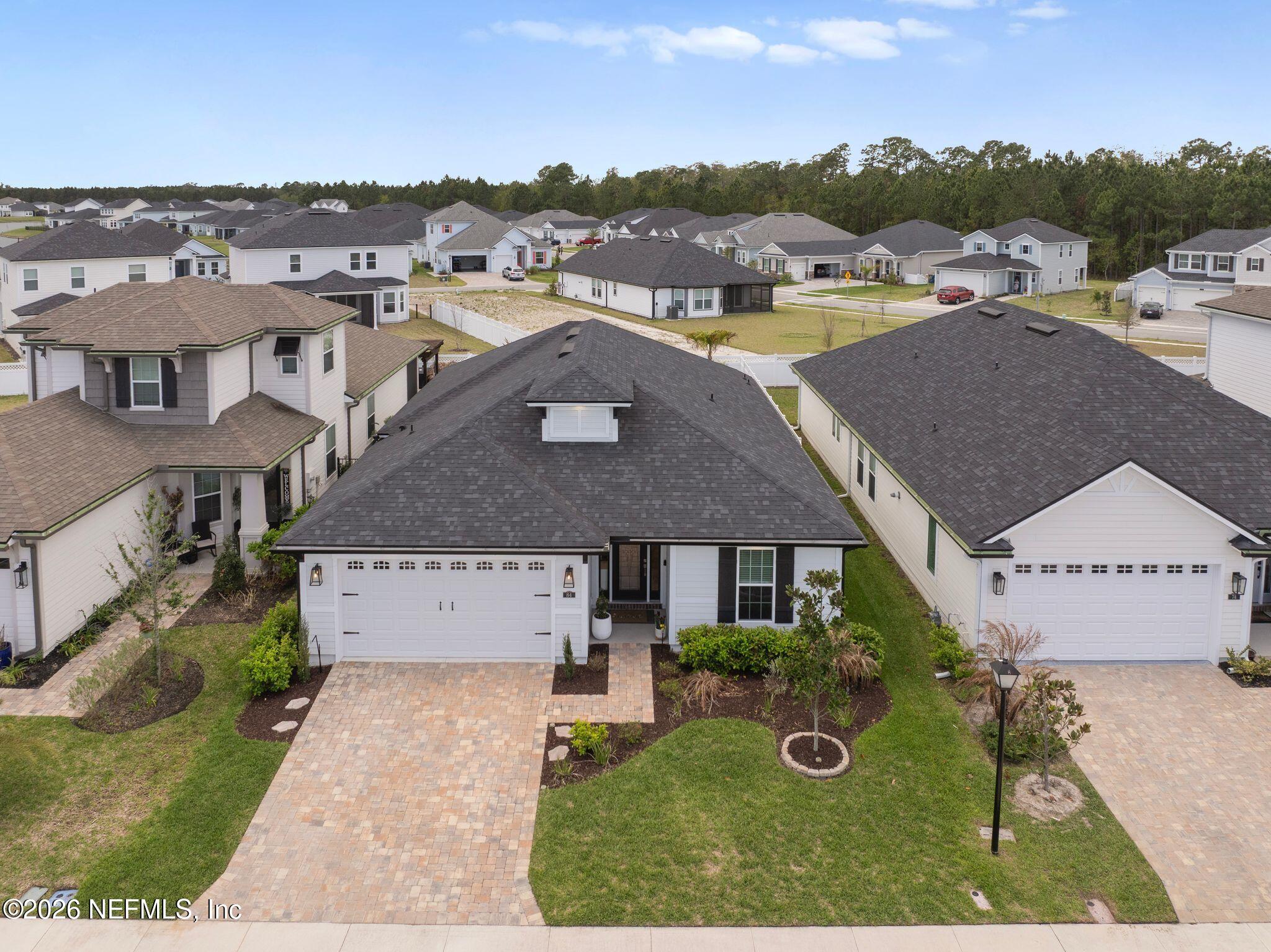84 Firecrest Drive St. Augustine, FL 32092 - Photo 54 of 72 an aerial view of multiple houses with a yard