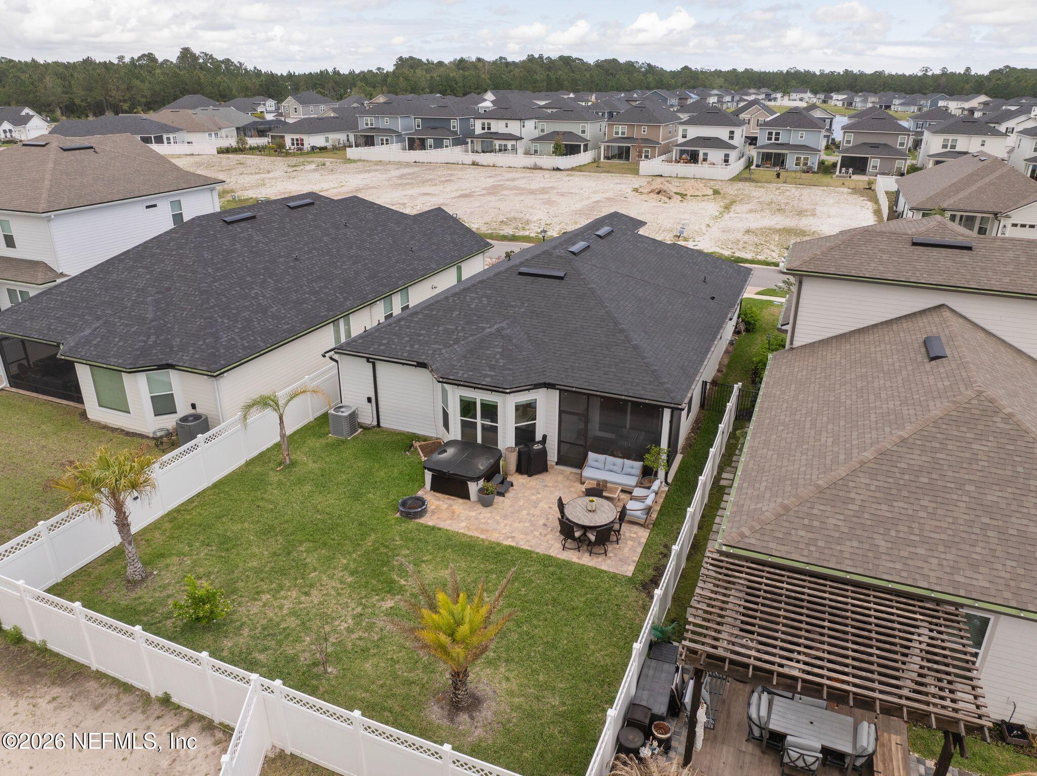 84 Firecrest Drive St. Augustine, FL 32092 - Photo 57 of 72 an aerial view of residential houses with outdoor space and seating