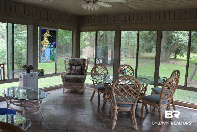 10375 Russ Road Daphne, AL 36526 - Photo 4 of 25 Sunroom overlooks the private back property, covered in beautiful mature oaks, zoned agricultural, a perfect mini farm