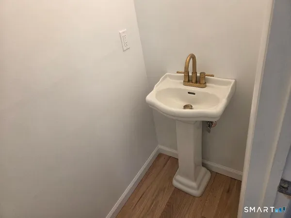 a bathroom with a sink and mirror