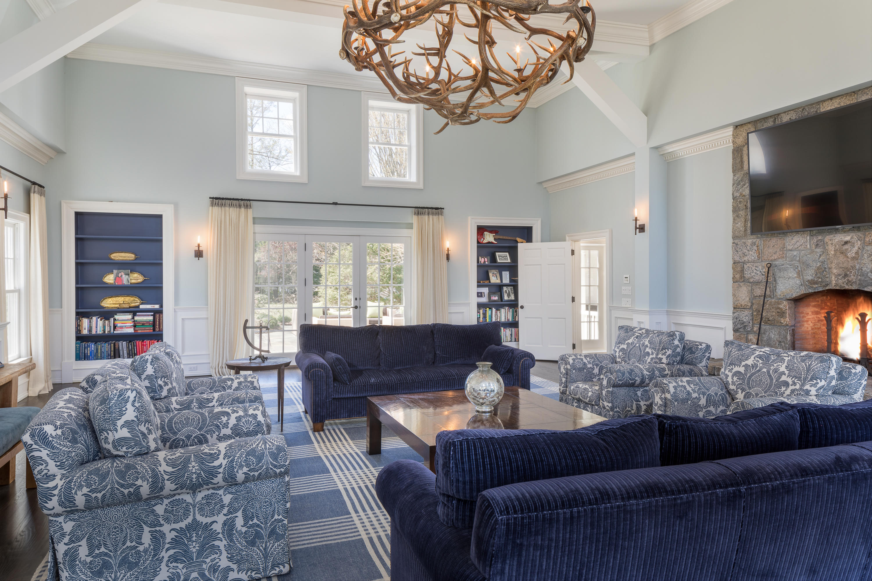 289 Oenoke Ridge New Canaan, CT 06840 - Photo 16 of 39 a living room with furniture and a large window