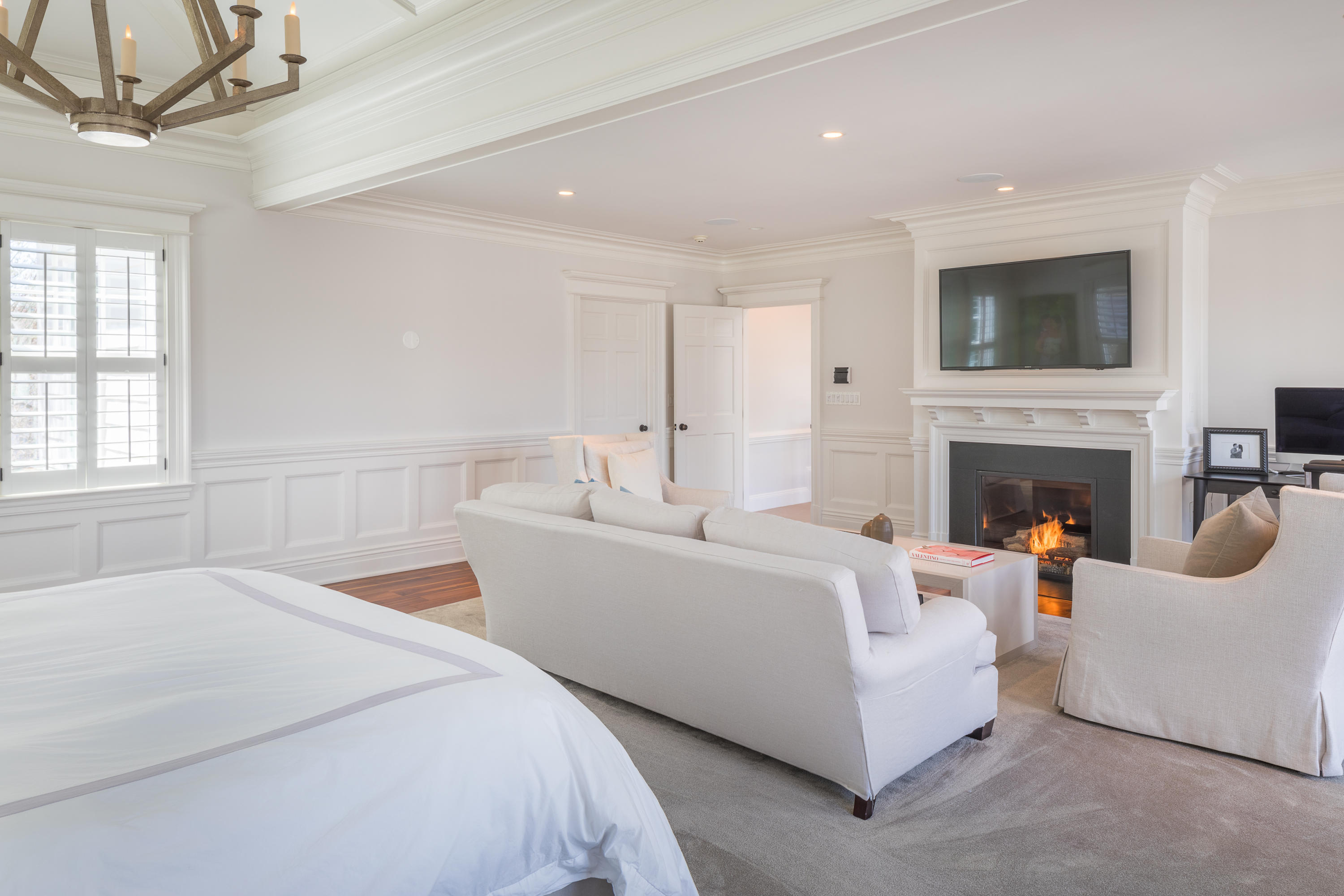 289 Oenoke Ridge New Canaan, CT 06840 - Photo 19 of 39 a bed room with a bed and a fireplace