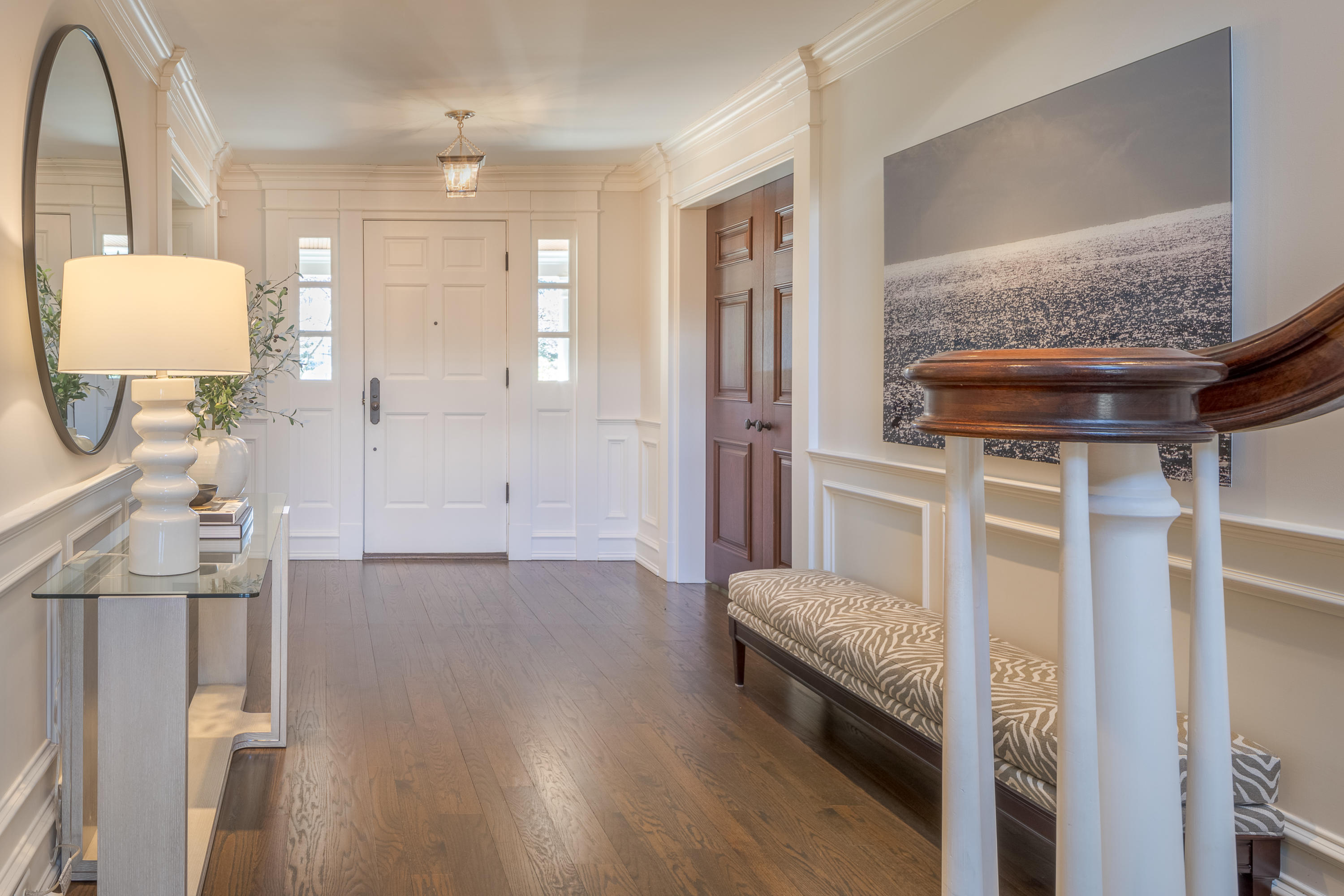 289 Oenoke Ridge New Canaan, CT 06840 - Photo 3 of 39 a bedroom with a bed and a mirror