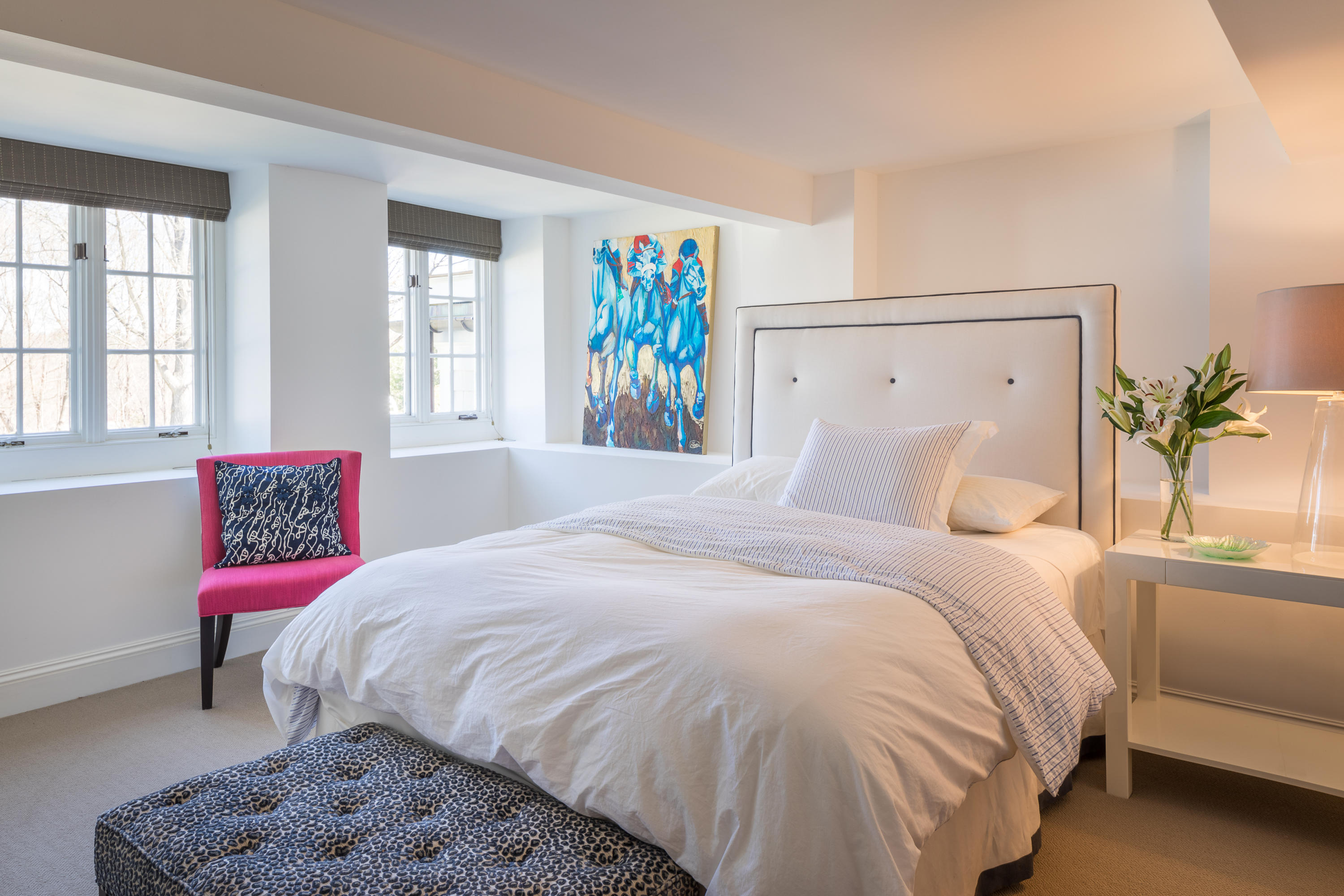 289 Oenoke Ridge New Canaan, CT 06840 - Photo 24 of 39 a bedroom with a bed a couch and a potted plant