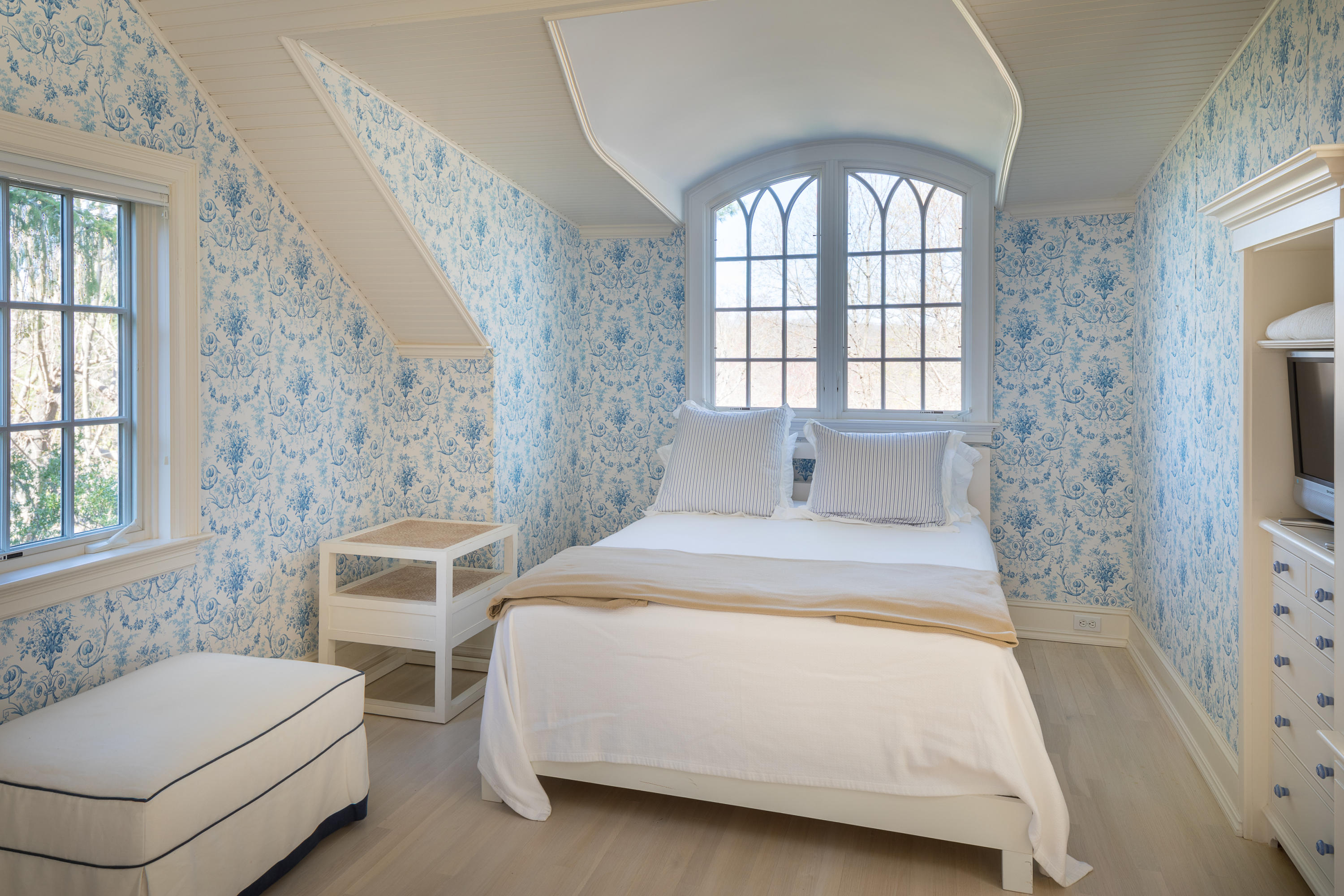 289 Oenoke Ridge New Canaan, CT 06840 - Photo 31 of 39 a spacious bedroom with a bed and a window