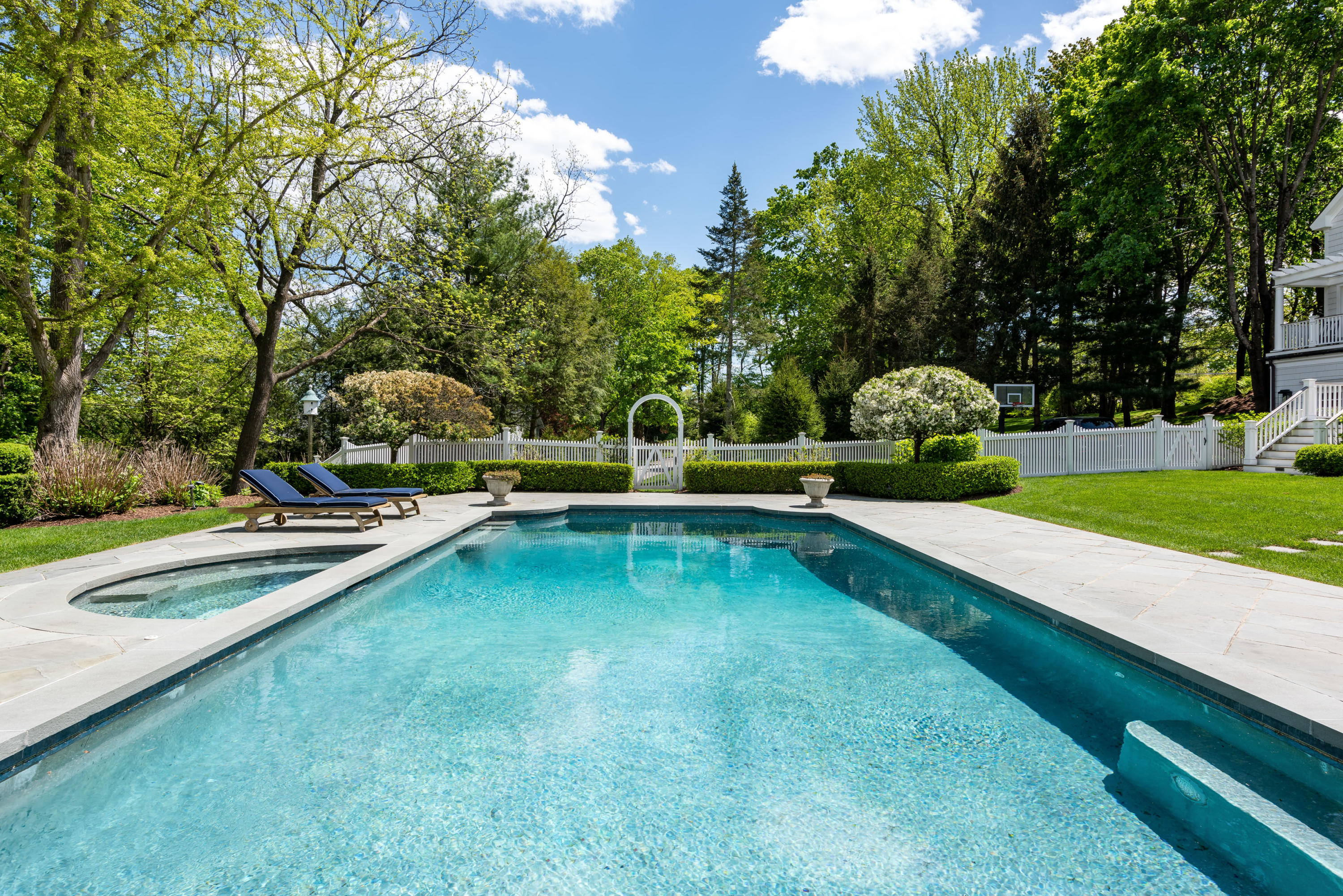 289 Oenoke Ridge New Canaan, CT 06840 - Photo 32 of 39 a view of swimming pool with lawn chairs and large trees