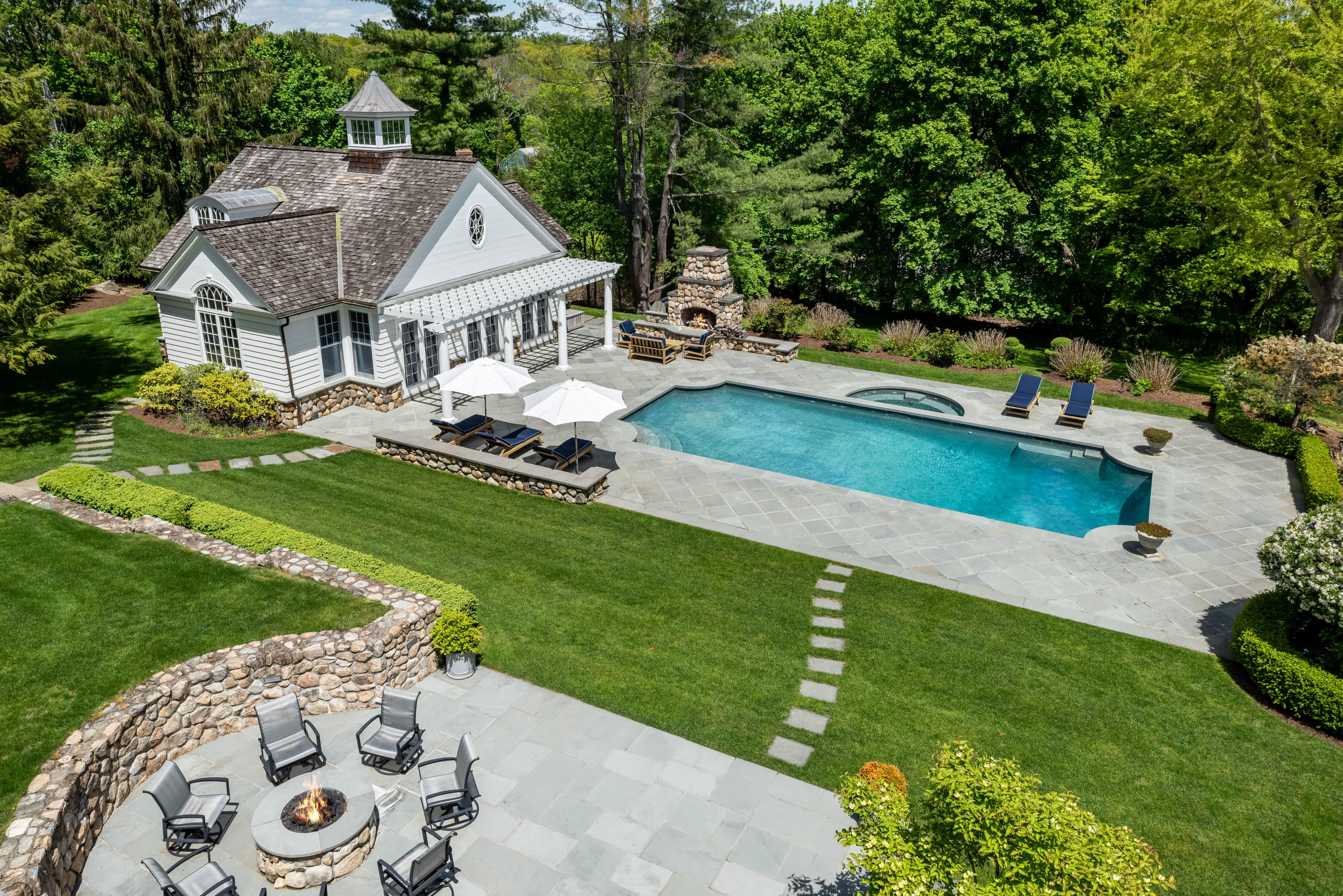 289 Oenoke Ridge New Canaan, CT 06840 - Photo 33 of 39 an aerial view of a house with swimming pool garden and patio