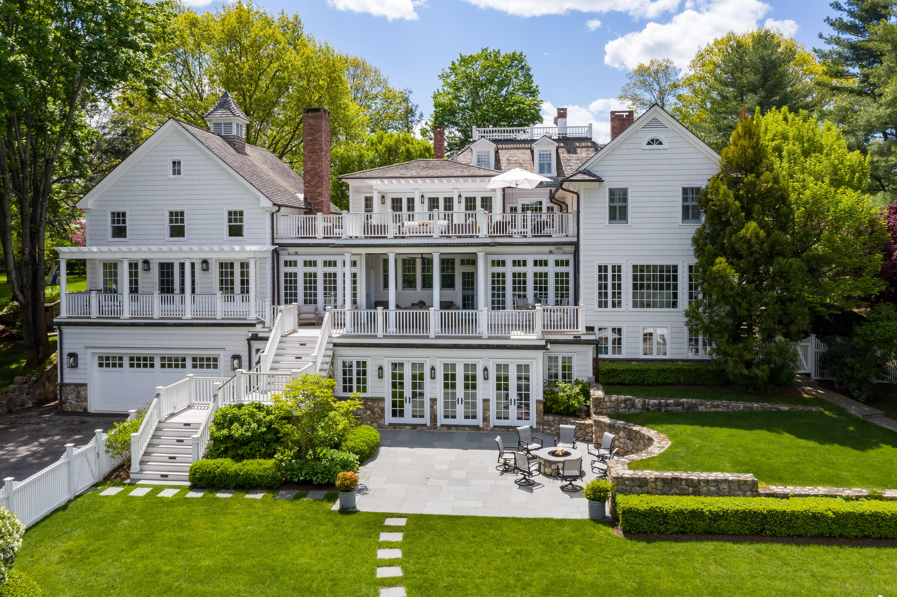 289 Oenoke Ridge New Canaan, CT 06840 - Photo 35 of 39 a view of a house with a yard and sitting area