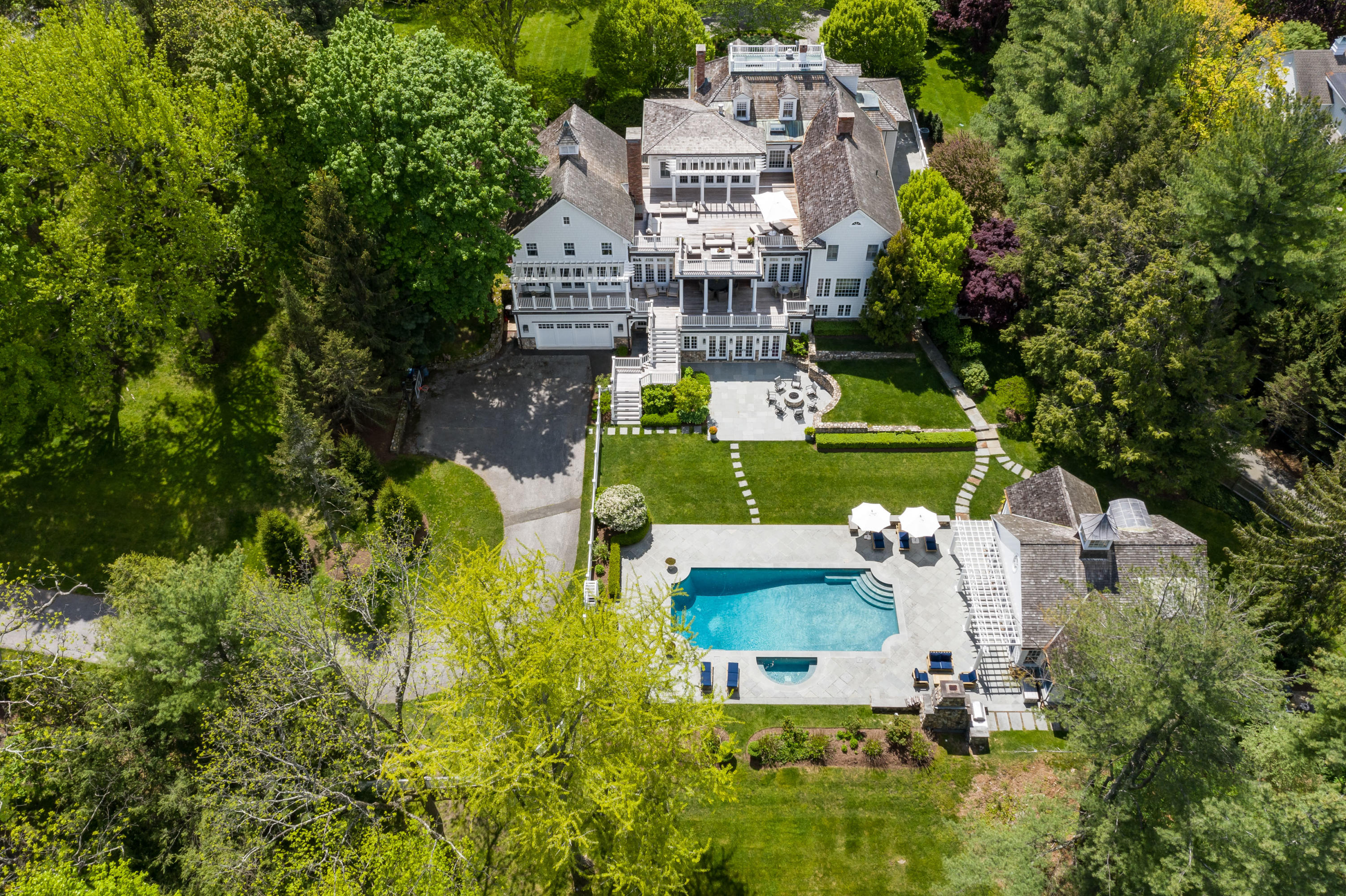 289 Oenoke Ridge New Canaan, CT 06840 - Photo 36 of 39 an aerial view of a house with a garden