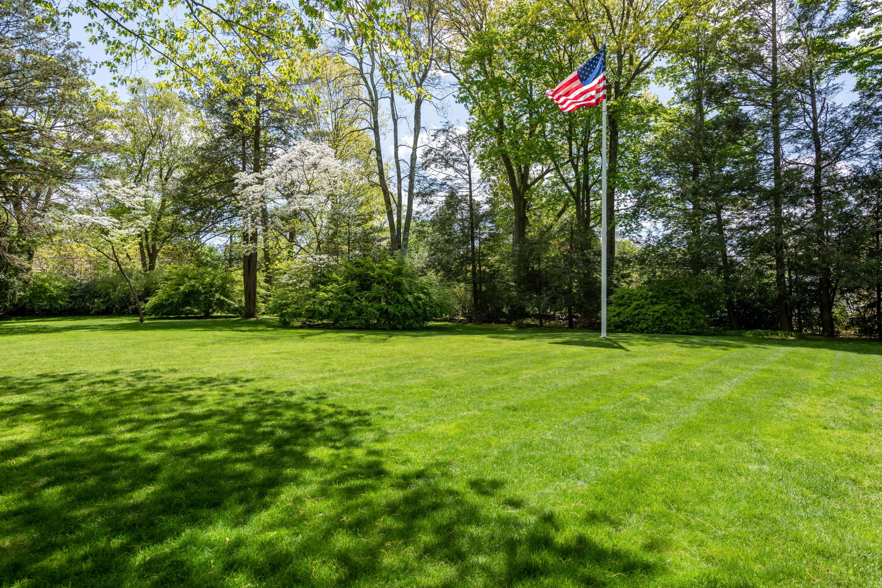 289 Oenoke Ridge New Canaan, CT 06840 - Photo 38 of 39 a backyard of a house with lots of green space