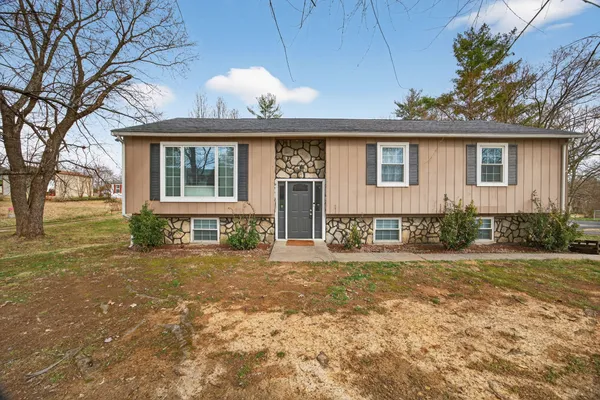 front view of a house with a yard
