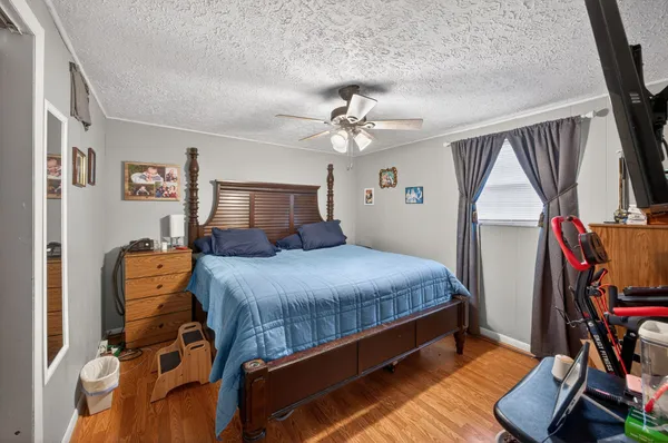a bed room with a bed and a chandelier
