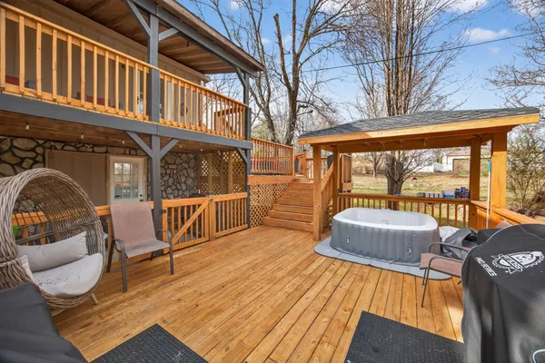 a view of a chairs and tables on the roof deck