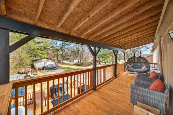 a outdoor space with wooden floor and outdoor seating