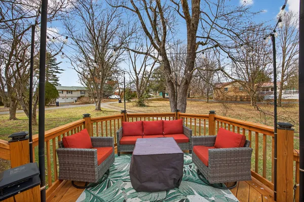 a view of sitting area with furniture and wooden deck