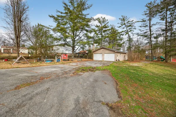 a house with huge tree in front of it