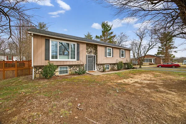 a front view of a house with a yard