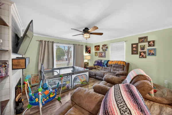 a living room with furniture and a window