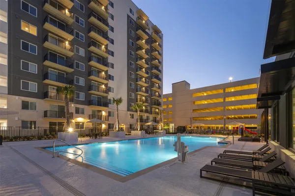 a view of swimming pool with outdoor seating