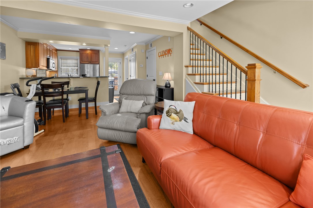 209 Calhoun Street, Unit 201 Clemson, SC 29631 - Photo 17 of 35 This inviting space features an open layout connecting the living area and kitchen, ideal for entertaining.