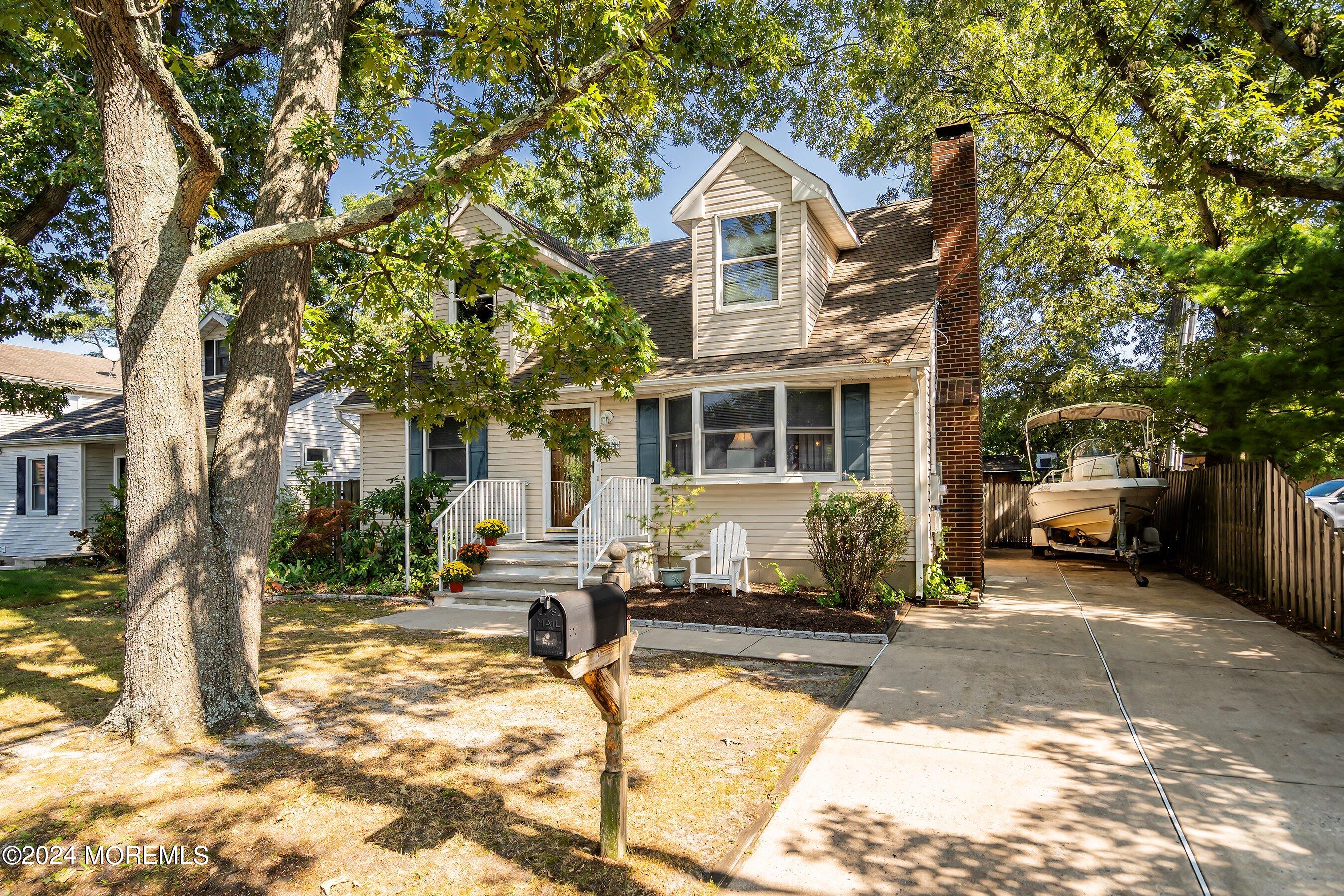1220 Lewis Road Point Pleasant, NJ 08742 - Photo 3 of 28 a front view of a house with a yard