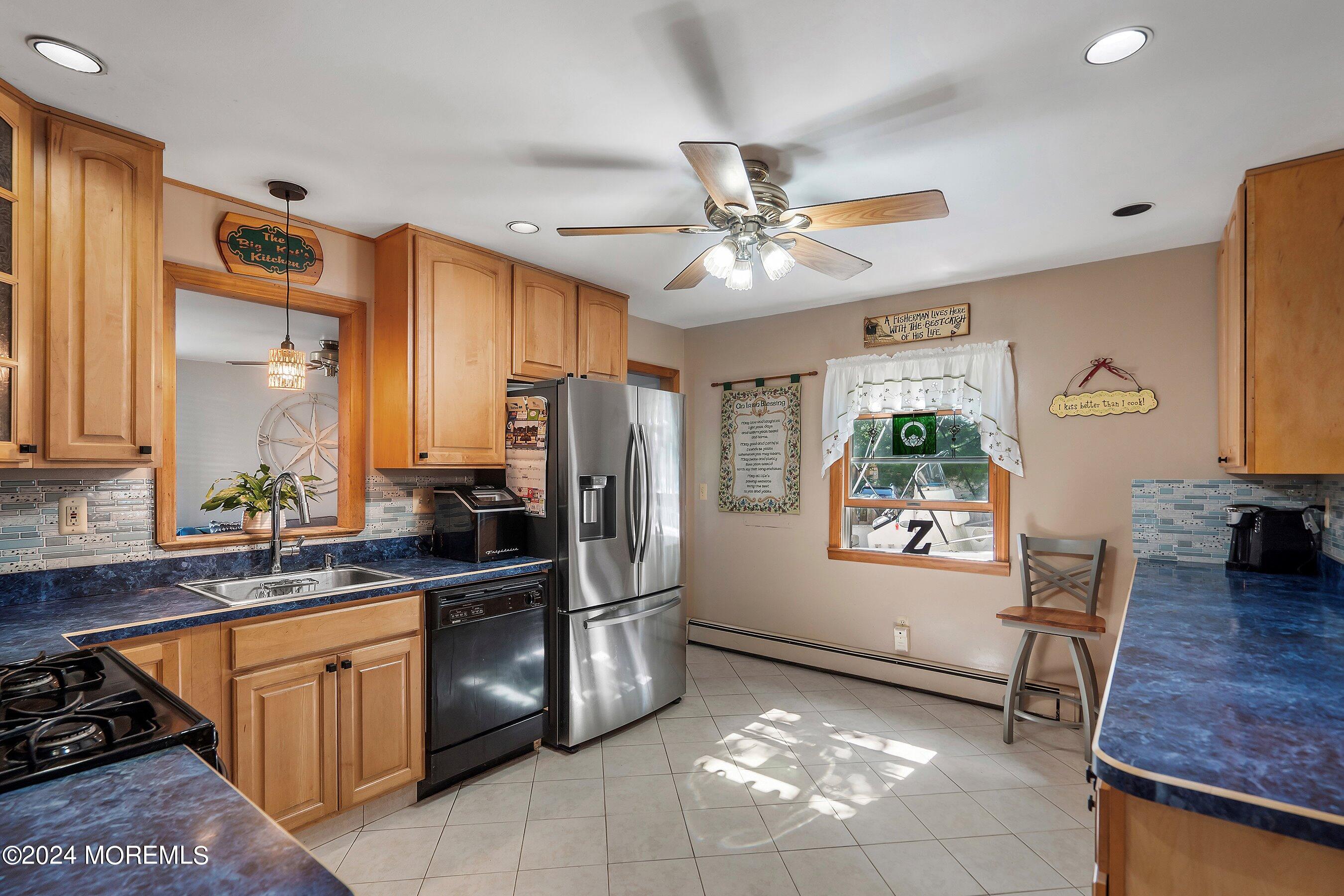 1220 Lewis Road Point Pleasant, NJ 08742 - Photo 9 of 28 a kitchen with stainless steel appliances granite countertop a refrigerator a sink dishwasher stove and oven