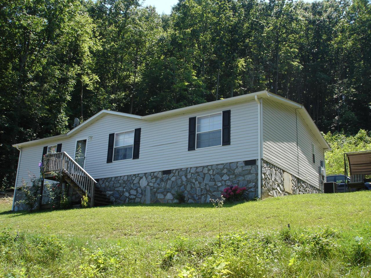 4141 Mountain View Church Road Blue Ridge, VA 24064 - Photo 2 of 13 a front view of a house with a yard