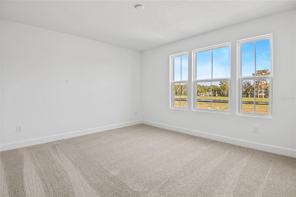 151 Waterstone Loop Tavares, FL 32778 - Photo 12 of 20 an empty room with windows