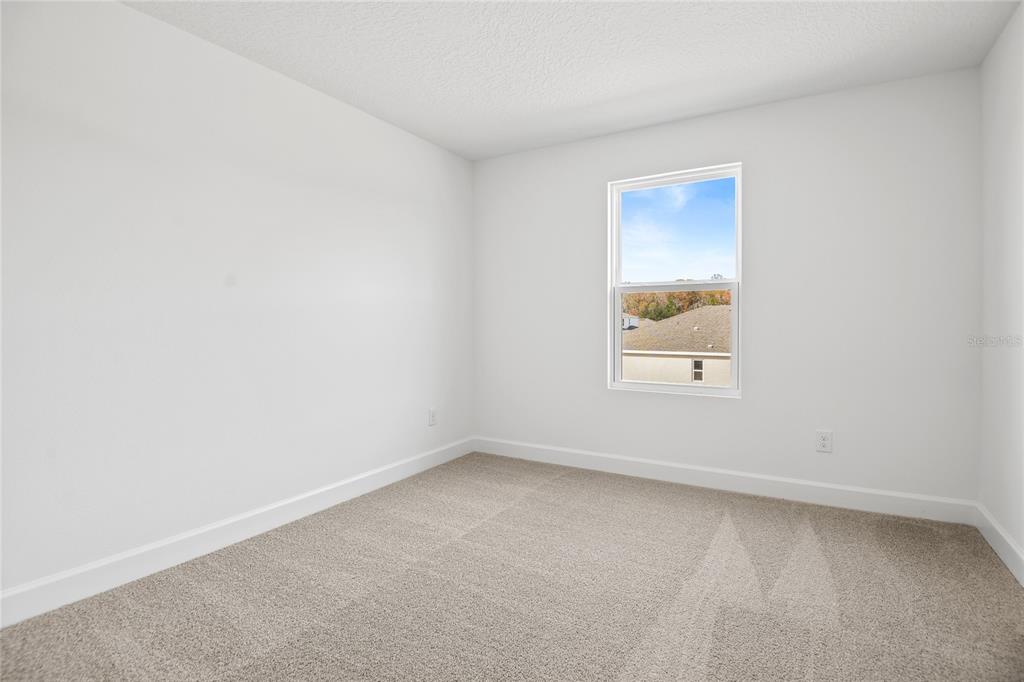 151 Waterstone Loop Tavares, FL 32778 - Photo 13 of 20 an empty room with a window