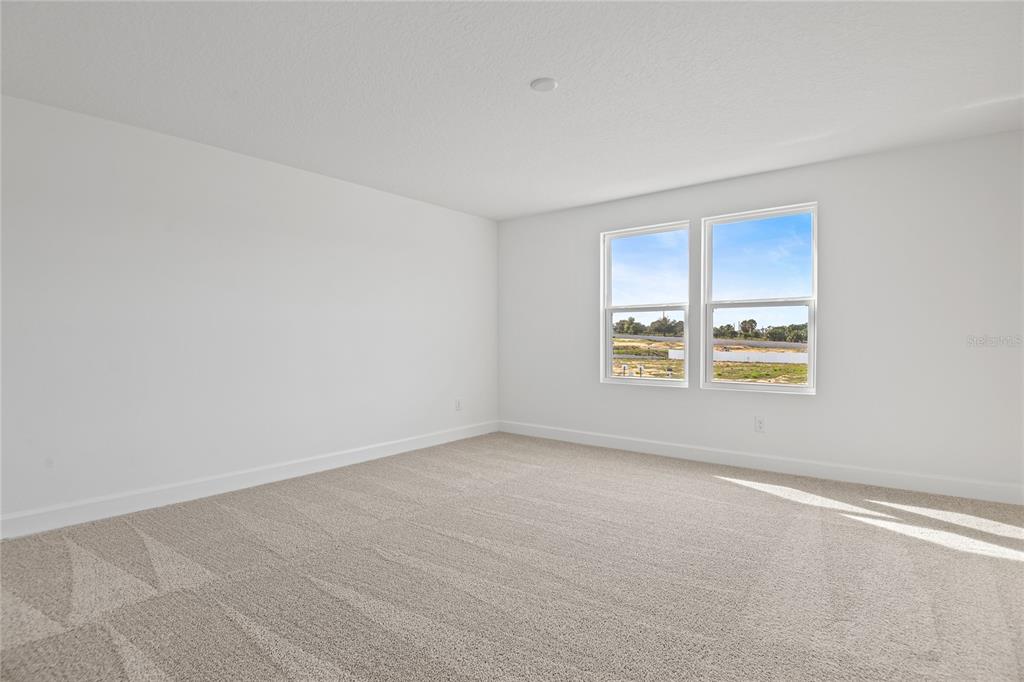 151 Waterstone Loop Tavares, FL 32778 - Photo 15 of 20 an empty room with windows