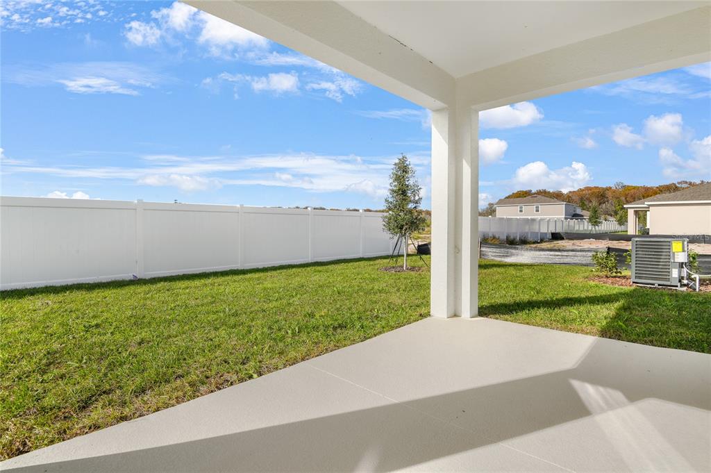151 Waterstone Loop Tavares, FL 32778 - Photo 19 of 20 a view of a yard with an outdoor space
