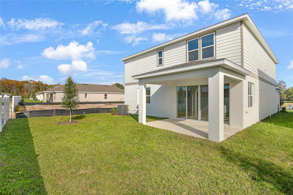151 Waterstone Loop Tavares, FL 32778 - Photo 20 of 20 a view of a house with a yard