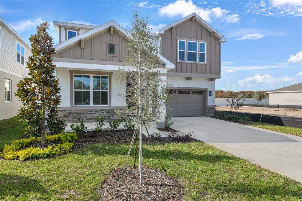 151 Waterstone Loop Tavares, FL 32778 - Photo 2 of 20 a front view of a house with a yard